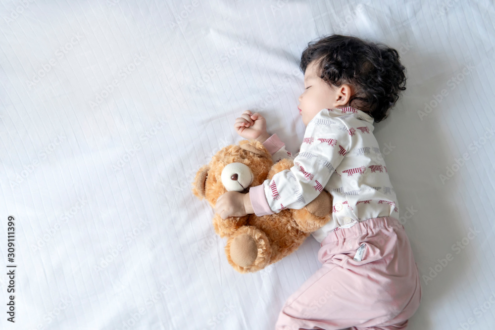 Asian baby sleeping on the white bed, New family and baby healthy concept