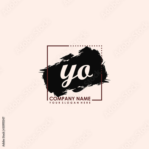 Initial letter YO handwriting logo template. with box lines, and brush inside