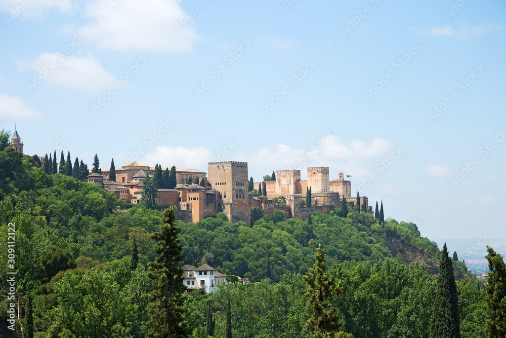 View to Alhambra form Sacromonte village famous for its houses made in caves at the hill slopes, Granada, Spain