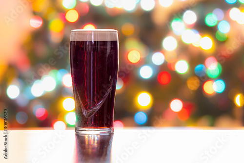 Photography A Stouts Dark Beer with Christmas lights on the background