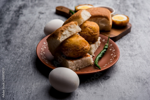 Egg Vada Pav or Anda  Wada Paav / Pao is a non-Vegetarian Fast Food Dish From Maharashtra, India photo