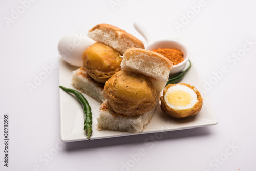 Egg Vada Pav or Anda  Wada Paav / Pao is a non-Vegetarian Fast Food Dish From Maharashtra, India photo