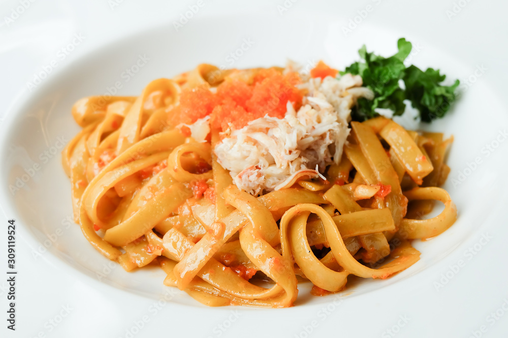 Crab Fettucini on white plate Crab Fettucini on white plate