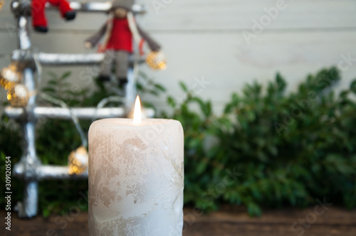 Big burning candle on New Year and Christmas background