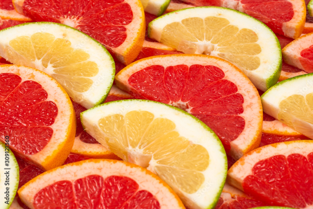 Pomelo and grapefruit slices background. Pomelo and grapefruit slices background.