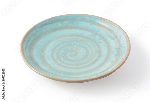 Tableau sur toile greenish-blue color hand-made plate on white background