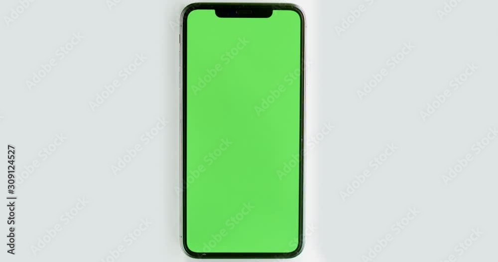 GREEN SCREEN CHROMA KEY Top view Caucasian female using her phone against white background, vertical orientation. 4K UHD RAW Graded footage GREEN SCREEN CHROMA KEY Top view Caucasian female using her phone against white background, vertical orientation. 4K UHD RAW Graded footage
