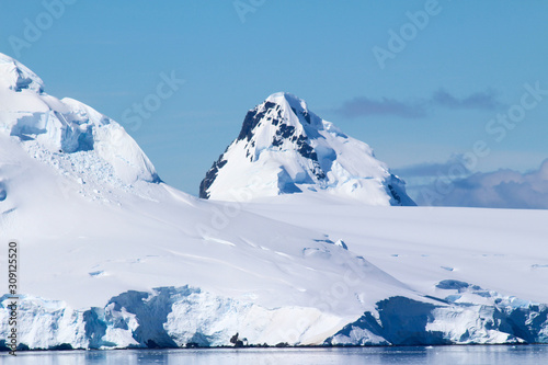 Snow-capped mountains on an island along the coasts of the Antarctic Peninsula, Palmer Archipelago, Antarctica