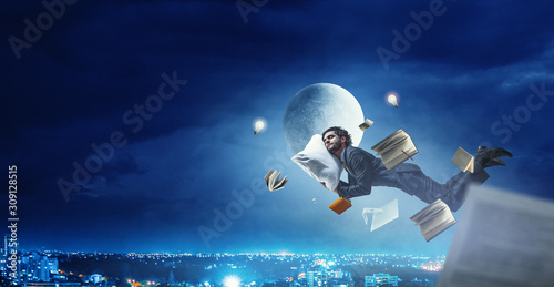 Tableau sur toile Overworked usinessman sleeping on pillow. Mixed media