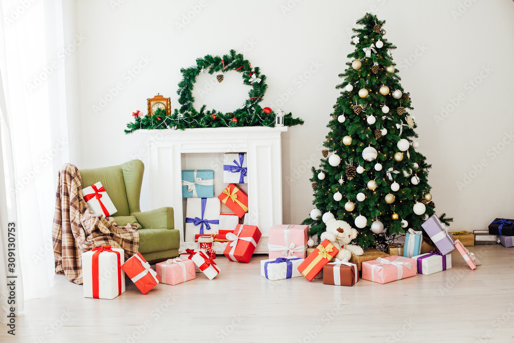 Christmas tree with gifts in the new year decor winter interior