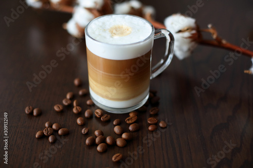 cereal coffee cappuccino in a glass and cotton on a dark background