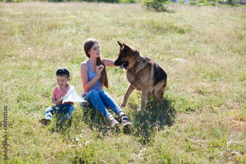 Woman on a walk with German Shepherd dog Woman on a walk with German Shepherd dog