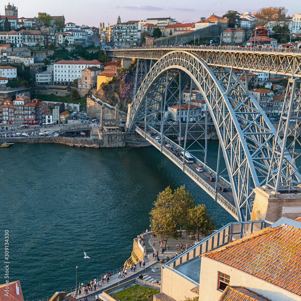 view from the hill to the Douro River and the beautiful Ponte Luis I Iron Bridge in the Portuguese city of Porto