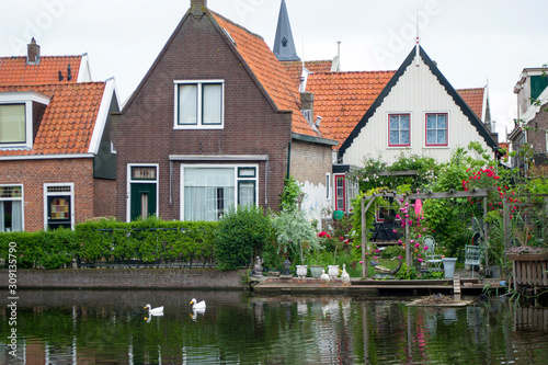 Views of the famous Dutch province - a medieval fishing town - Volendam. Now - a residential village and a famous tourist attraction.Dutch village architecture.