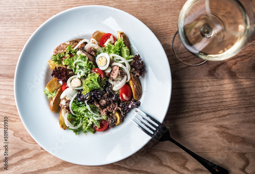 healthy delicious salad with wite wine