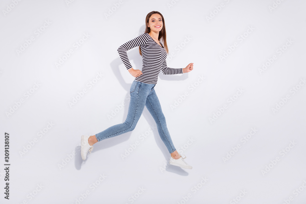 Full length body size view of her she nice-looking attractive winsome charming cheerful cheery straight-haired girl running having fun free spare time weekend isolated over white light background