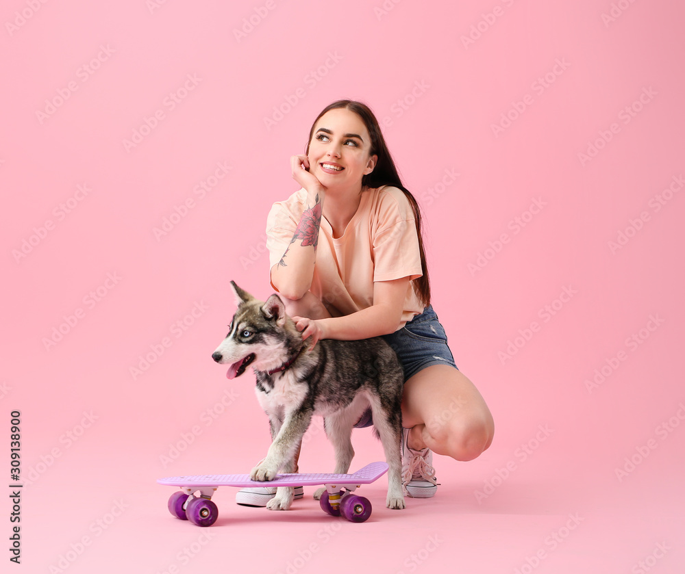 Cute woman with funny husky puppy and skateboard on color background Stock  Photo | Adobe Stock