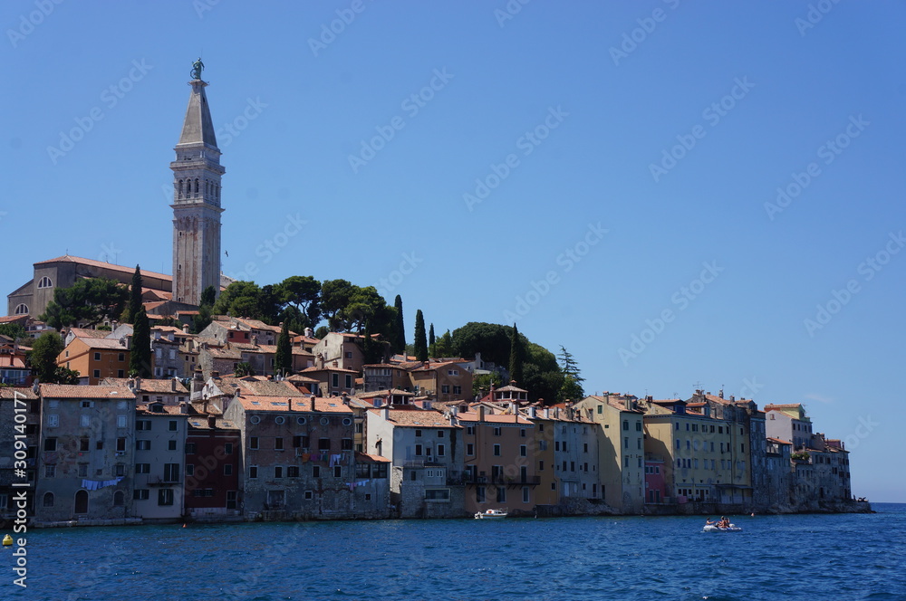 Old town with church surrounded by old houses in the adriatic sea