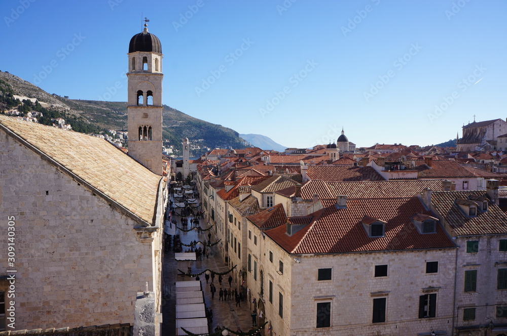 Dubrovnik old town walking street viewed towards old church on the left and old houses on the right