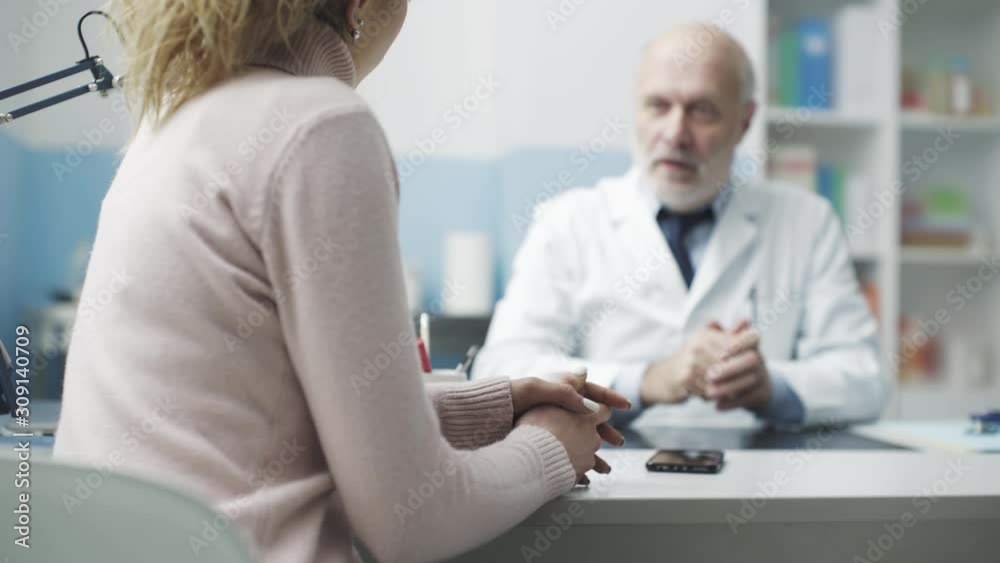 Doctor examining a patient's x-ray image during a visit