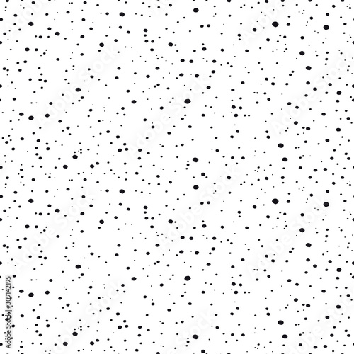 Seamless pattern with small black dots. Randomly disposed spots. Minimalist dots background. Black and white vector texture.