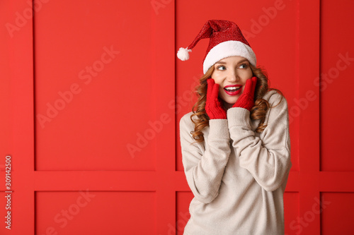 Surprised young woman in wi...