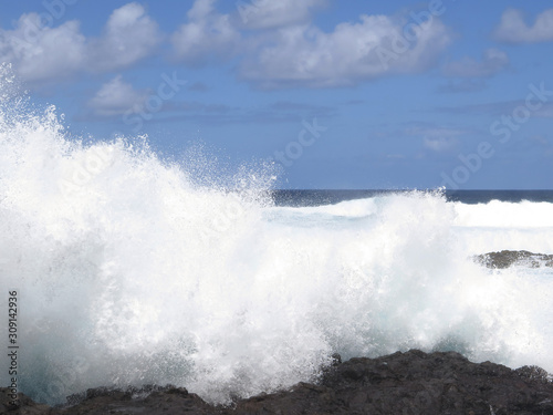 High waves crashing against lava rocks