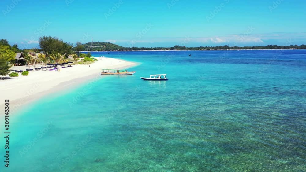 Boat Slowly Moving Onto The Sandy Shore Of The Lush Island Surrounded By Bright Blue Sea Water With Coral Reef At The Bottom - Wide Shot Boat Slowly Moving Onto The Sandy Shore Of The Lush Island Surrounded By Bright Blue Sea Water With Coral Reef At The Bottom - Wide Shot