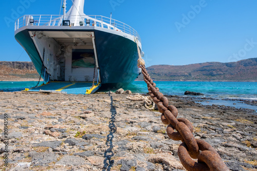 cruise liner moored off the coast with an open hold photo