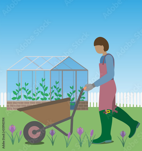 Person driving wheelbarrow for springtime's gardening work.