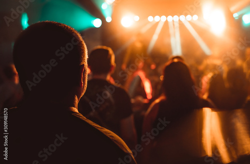 Valokuva Fans rocks on your music with ambience light and hard beats filming the concert