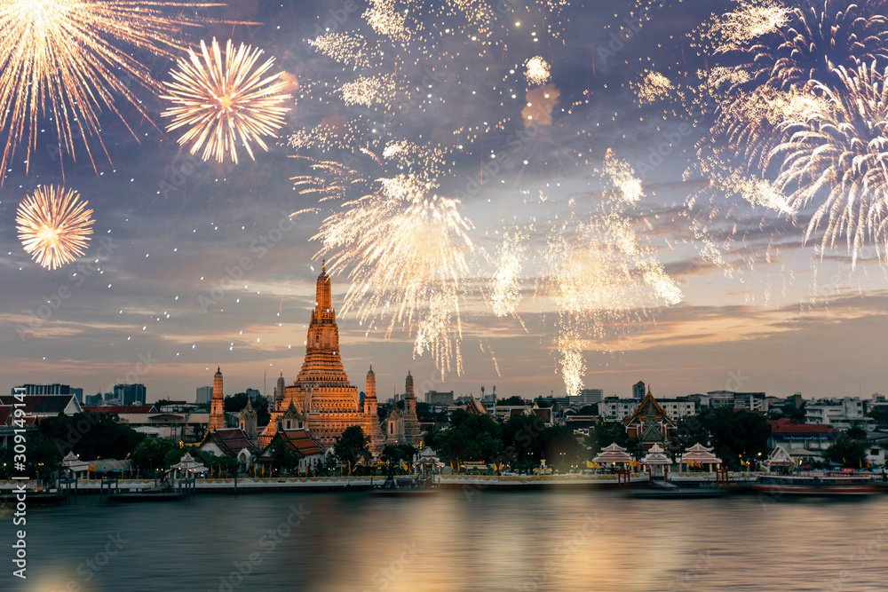 Wat Arun temple in bangkok with fireworks. New year and holiday concept.