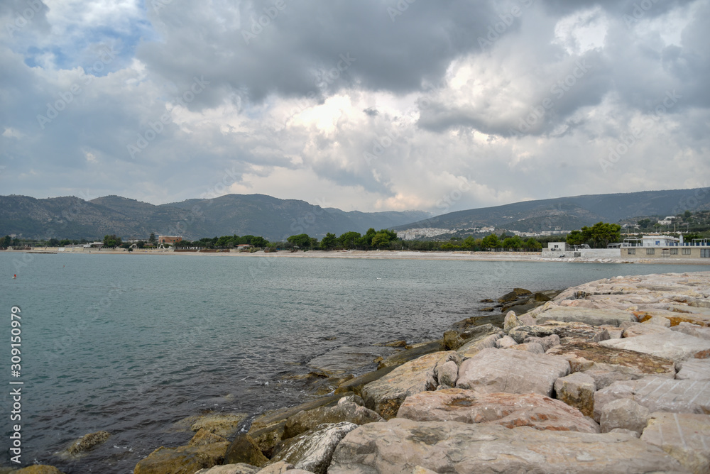 Rocks in the Beach of Mattinata with Cloudy Sky Rocks in the Beach of Mattinata with Cloudy Sky
