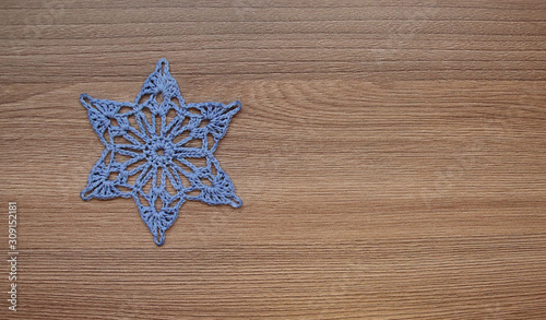 Six-pointed star embroidered from threads.