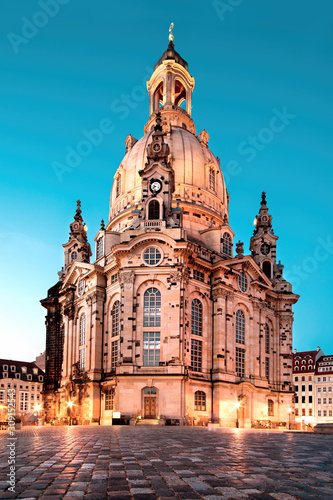 Illuminated Church of Our Lady  or Frauenkirche  at night in Dresden  Germany  on a quiet evening with blue sky. Famous travel landmark and symbol of Peace in Saxony  Germany.