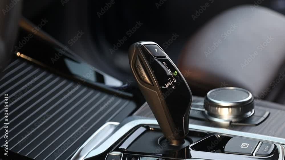 Closeup. Gear selector shift lever in the interior of a premium