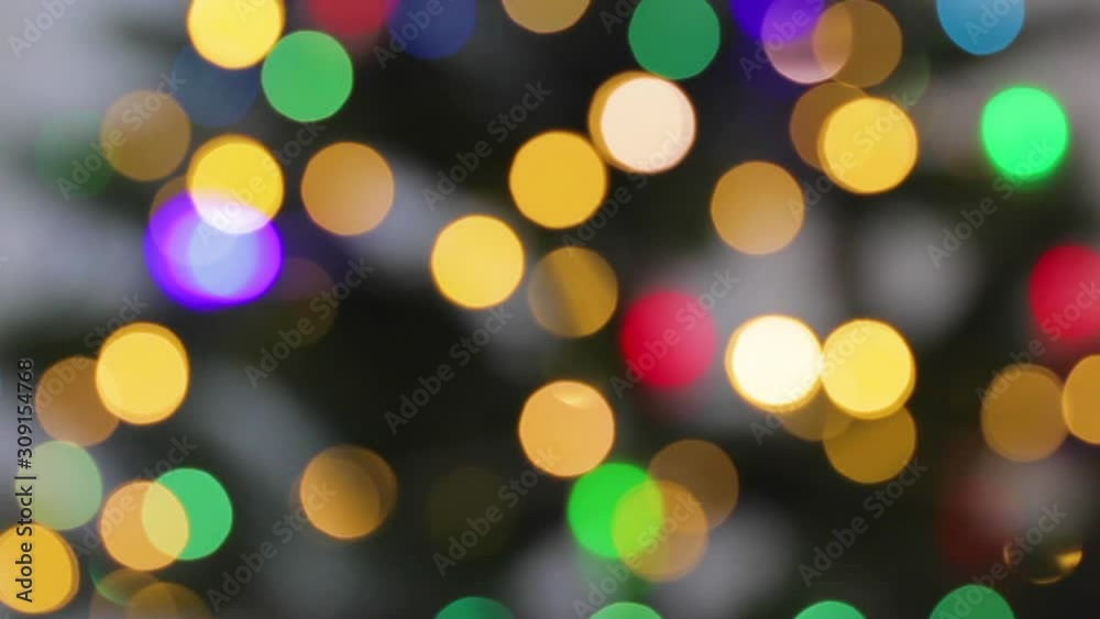 Abstract Blurred Christmas Lights Bokeh Background. Blinking Christmas Tree Lights Twinkling. Winter Holidays Concept. Christmas and new year decoration.