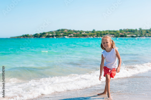 Happy kid looking at camera background beautiful sky and sea © travnikovstudio