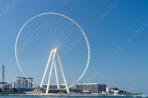 View of Dubai Ferris Wheel from Jumeirah Beach © Артамошкин Максим