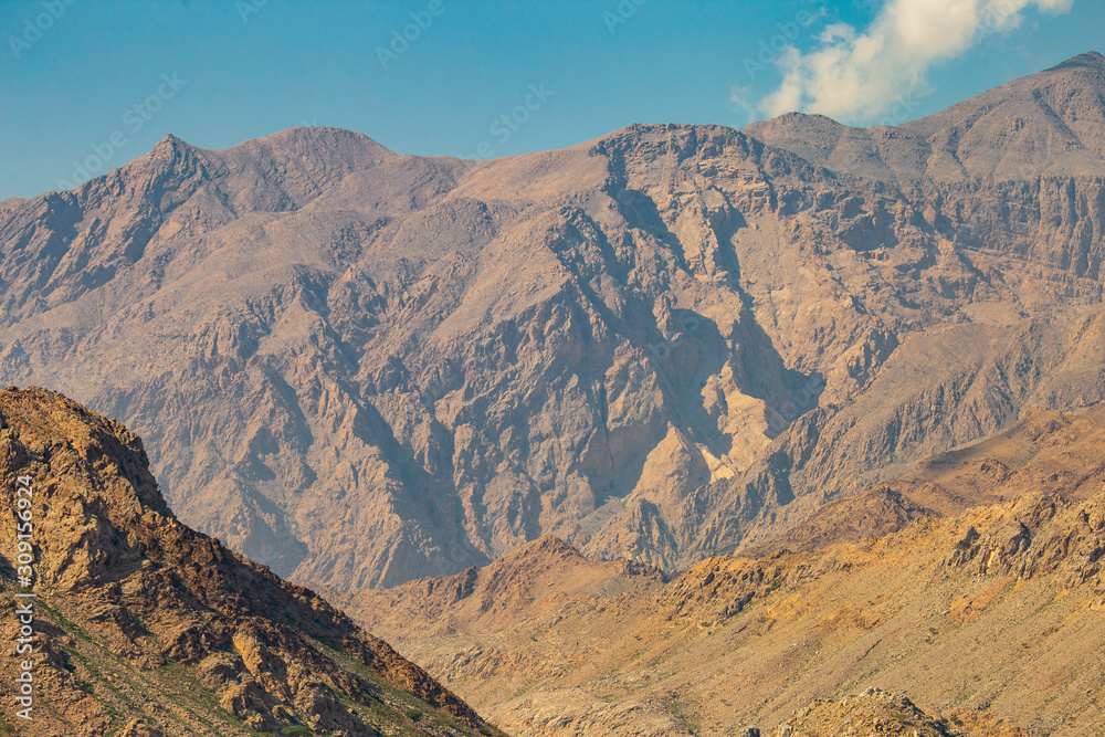 mountains of Oman on the sea against the blue sky