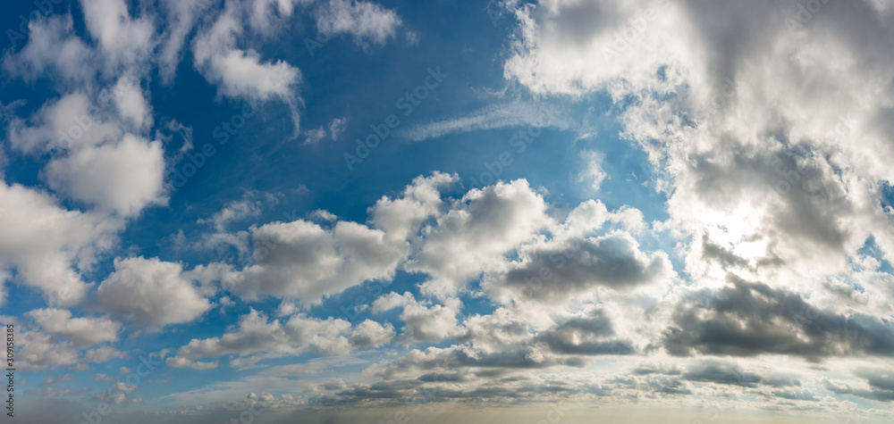 Obraz premium Fantastic clouds against blue sky, panorama