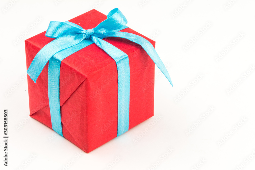 Gift box with ribbons and christmas decor isolated on white background. Happy birthday colorful gift Gift box with ribbons and christmas decor isolated on white background. Happy birthday colorful gift