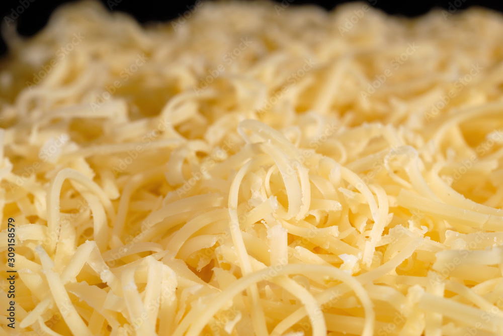 Salad seasoned with mayonnaise and sprinkled with grated cheese. Shallow depth of field Salad seasoned with mayonnaise and sprinkled with grated cheese. Shallow depth of field