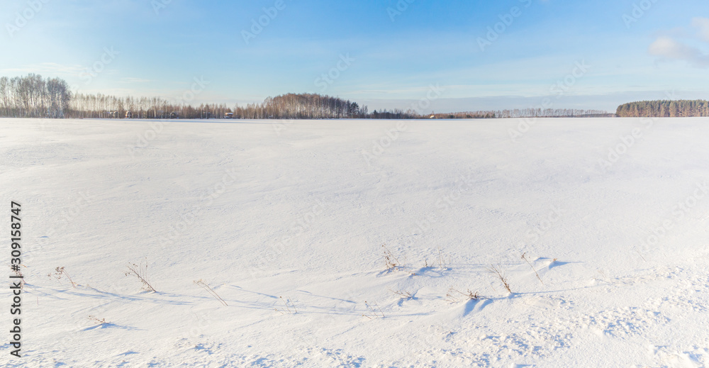 Snow covered field on a day Snow covered field on a day
