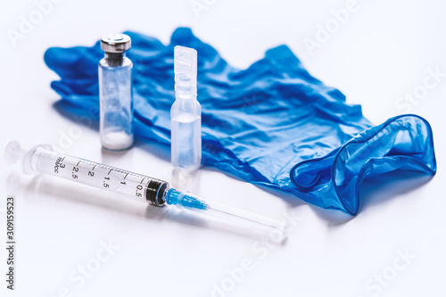 Vaccination is a method of creating immunity. Syringes, water for injections, ampoules medical gloves. The concept of vaccination.