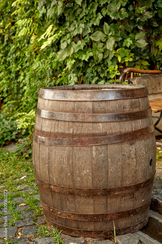 old wine barrel on the paving stones