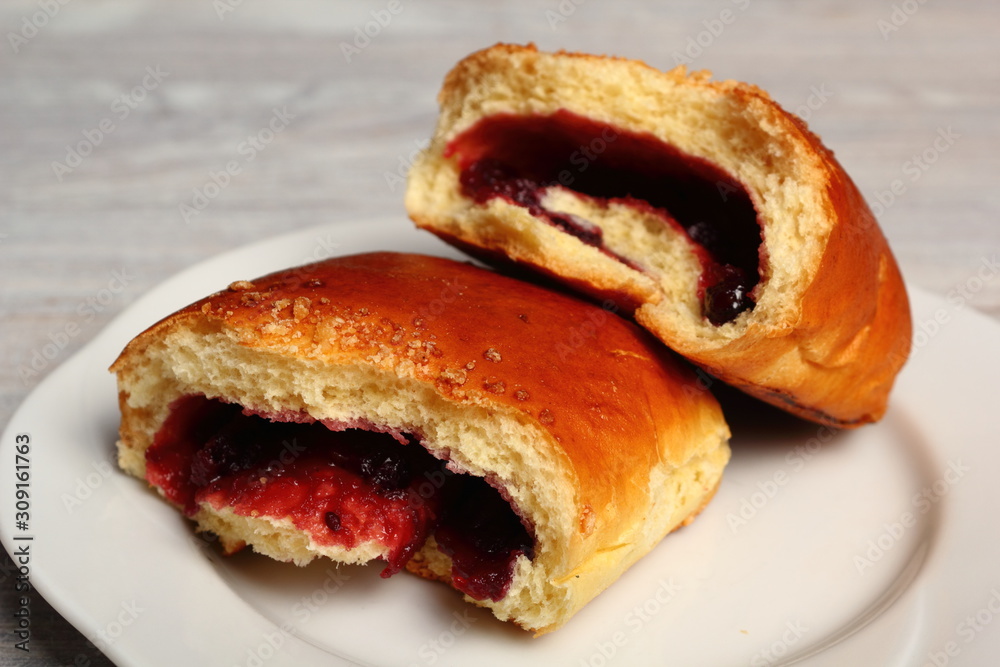 Blueberry Bun. Bun made from yeast dough, filled with bilberries, delicately covered with crumble.
