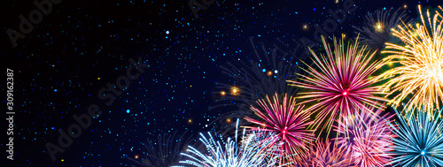Colorful firework on night sky.New Year background.