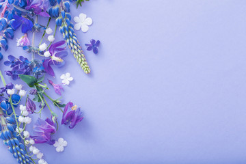 purple, blue, pink flowers on paper background