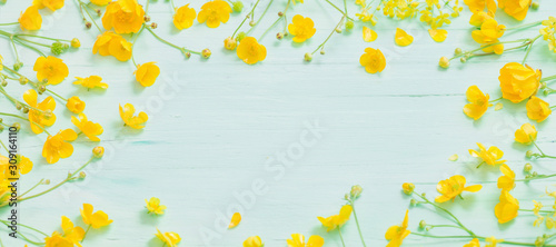 summer flowers on green wooden background